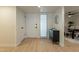 Bright, newly remodeled foyer with wood floors leads to the dining room and living room at 12946 W Maplewood Dr, Sun City West, AZ 85375