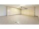 Spacious garage with epoxy flooring and built in cabinetry at 12946 W Maplewood Dr, Sun City West, AZ 85375