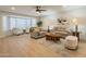 Bright and airy living room features laminate floors and recessed lighting at 12946 W Maplewood Dr, Sun City West, AZ 85375