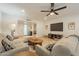 Spacious living room showcasing an open layout, wood floors, and comfortable seating at 12946 W Maplewood Dr, Sun City West, AZ 85375