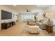 Spacious living room with recessed lighting, laminate floors, and large bay windows at 12946 W Maplewood Dr, Sun City West, AZ 85375