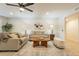 Comfortable living room featuring laminate floors, neutral paint and recessed lighting at 12946 W Maplewood Dr, Sun City West, AZ 85375