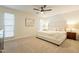 Spacious and cozy main bedroom features carpet, ceiling fan, two windows and designer-coordinated furnishing at 12946 W Maplewood Dr, Sun City West, AZ 85375