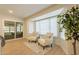 Relaxing sun room with comfortable chairs, lots of windows and natural light at 12946 W Maplewood Dr, Sun City West, AZ 85375
