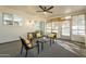Sunroom with a ceiling fan, comfortable seating and large windows offering lots of light at 12946 W Maplewood Dr, Sun City West, AZ 85375