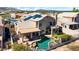 Backyard aerial view showcasing pool, spa, covered patio, balcony, solar panels and fenced yard at 1302 E Voltaire Ave, Phoenix, AZ 85022