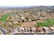 An attractive aerial view of a residential neighborhood situated near a golf course and mountains at 1302 E Voltaire Ave, Phoenix, AZ 85022