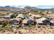 Expansive aerial view of a residential neighborhood with private pools and stunning mountain backdrop at 1302 E Voltaire Ave, Phoenix, AZ 85022
