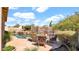 Inviting outdoor space with a pool, waterfall, and patio seating, perfect for entertaining at 1302 E Voltaire Ave, Phoenix, AZ 85022