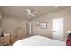 Bedroom with plush carpet, neutral walls, ceiling fan, and wood dresser at 1302 E Voltaire Ave, Phoenix, AZ 85022