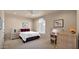 Comfortable bedroom with neutral walls, plush carpet, and ample natural light from the large windows at 1302 E Voltaire Ave, Phoenix, AZ 85022