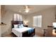 Bedroom with a large window and a ceiling fan at 1302 E Voltaire Ave, Phoenix, AZ 85022