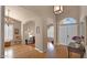 Grand foyer with high ceilings, hardwood floors, and an open layout leading to other living areas at 1302 E Voltaire Ave, Phoenix, AZ 85022