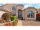 Beautiful home entrance surrounded by lush landscaping and charming benches for a welcoming curb appeal at 1302 E Voltaire Ave, Phoenix, AZ 85022