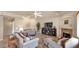 Comfortable living room with tile flooring, a ceiling fan, a fireplace, and comfortable seating at 1302 E Voltaire Ave, Phoenix, AZ 85022