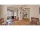 Spacious open-concept living area features hardwood floors, natural light, and seamless flow to other living spaces at 1302 E Voltaire Ave, Phoenix, AZ 85022