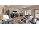 Comfortable living room featuring a fireplace, built-in shelving, and ample natural light at 1302 E Voltaire Ave, Phoenix, AZ 85022