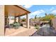 Outdoor space with a covered patio, green metal furniture, BBQ grill, and a pool at 1302 E Voltaire Ave, Phoenix, AZ 85022