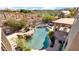Aerial view of a backyard pool, spa, patio, and covered outdoor dining area with desert views at 1302 E Voltaire Ave, Phoenix, AZ 85022