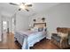 Cozy bedroom features a comfortable bed, stylish decor, and ample natural light for a relaxing retreat at 13534 W Young St, Surprise, AZ 85374