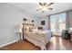 Charming bedroom includes a cozy bed, a private exterior patio, and tasteful decor at 13534 W Young St, Surprise, AZ 85374