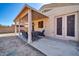 Relaxing covered patio with seating, offering seamless indoor-outdoor living at 13534 W Young St, Surprise, AZ 85374