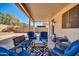 Inviting covered patio with stylish seating, perfect for outdoor relaxation and entertaining at 13534 W Young St, Surprise, AZ 85374