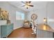 Office space with a large desk, comfortable chair, and hardwood floors at 13534 W Young St, Surprise, AZ 85374