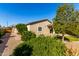This backyard features lush desert landscaping and a patch of artificial grass at 141 W Jamaica Pl, Casa Grande, AZ 85122