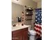 Functional bathroom with a double sink vanity and a tiled shower/tub combo, complemented by a large mirror at 141 W Jamaica Pl, Casa Grande, AZ 85122