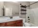 This bathroom has a dark vanity, a white countertop, a big mirror and a shower/tub combo at 141 W Jamaica Pl, Casa Grande, AZ 85122