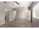 Spacious bedroom with carpeted floors and natural light from the window at 141 W Jamaica Pl, Casa Grande, AZ 85122
