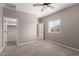Bright bedroom with carpeted floors, ceiling fan, and neutral paint color at 141 W Jamaica Pl, Casa Grande, AZ 85122