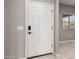 Welcoming front door entrance with a smart lock and a view to a window at 141 W Jamaica Pl, Casa Grande, AZ 85122