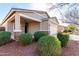 Charming front exterior with well-maintained landscaping and a covered porch area at 141 W Jamaica Pl, Casa Grande, AZ 85122