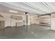 This garage has a finished floor, lots of storage and gray cabinets at 141 W Jamaica Pl, Casa Grande, AZ 85122