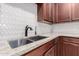 Close-up of the kitchen sink featuring stainless steel fixtures and granite countertops at 141 W Jamaica Pl, Casa Grande, AZ 85122