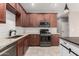 Well-equipped kitchen with stainless steel appliances, granite countertops, and tile backsplash at 141 W Jamaica Pl, Casa Grande, AZ 85122