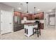 Well-equipped kitchen featuring a kitchen island, stainless steel appliances, and tile backsplash at 141 W Jamaica Pl, Casa Grande, AZ 85122