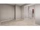 Bright, open living area with tile flooring and access to other rooms at 141 W Jamaica Pl, Casa Grande, AZ 85122