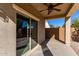 This is an outdoor patio with a ceiling fan and sliding door at 141 W Jamaica Pl, Casa Grande, AZ 85122