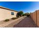 This side yard has pavers and desert landscaping at 141 W Jamaica Pl, Casa Grande, AZ 85122