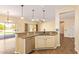 Open kitchen showcases a breakfast bar with granite counters and stainless steel dishwasher at 16016 W Indigo Ln, Surprise, AZ 85374