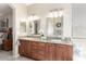 Bathroom featuring granite countertops, and sinks, and modern light fixtures at 16601 S 16Th Dr, Phoenix, AZ 85045