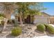 Inviting home exterior with lush landscaping, mature trees, and a well-maintained front yard at 16601 S 16Th Dr, Phoenix, AZ 85045