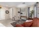 Inviting living room featuring a comfortable seating area, neutral tones, and a large window at 16601 S 16Th Dr, Phoenix, AZ 85045