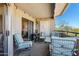 Outdoor covered patio featuring lounge chairs, a table, and a mountain view at 1720 E Thunderbird Rd # 2090, Phoenix, AZ 85022