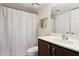 Bathroom featuring a toilet, dark vanity, mirror, and white shower curtain at 1720 E Thunderbird Rd # 2090, Phoenix, AZ 85022