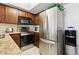 Bright kitchen with modern stainless steel appliances and wooden cabinets at 1720 E Thunderbird Rd # 2090, Phoenix, AZ 85022
