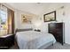 Well-lit bedroom with a large window and a neutral color palette at 1720 E Thunderbird Rd # 2090, Phoenix, AZ 85022